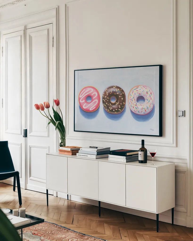 Doughnuts by Wellington Studio. shown as a framed stretched canvas in a living room above a console. Available as a archival giclee rolled canvas, fine art paper, or poster print. SKU 90650i.