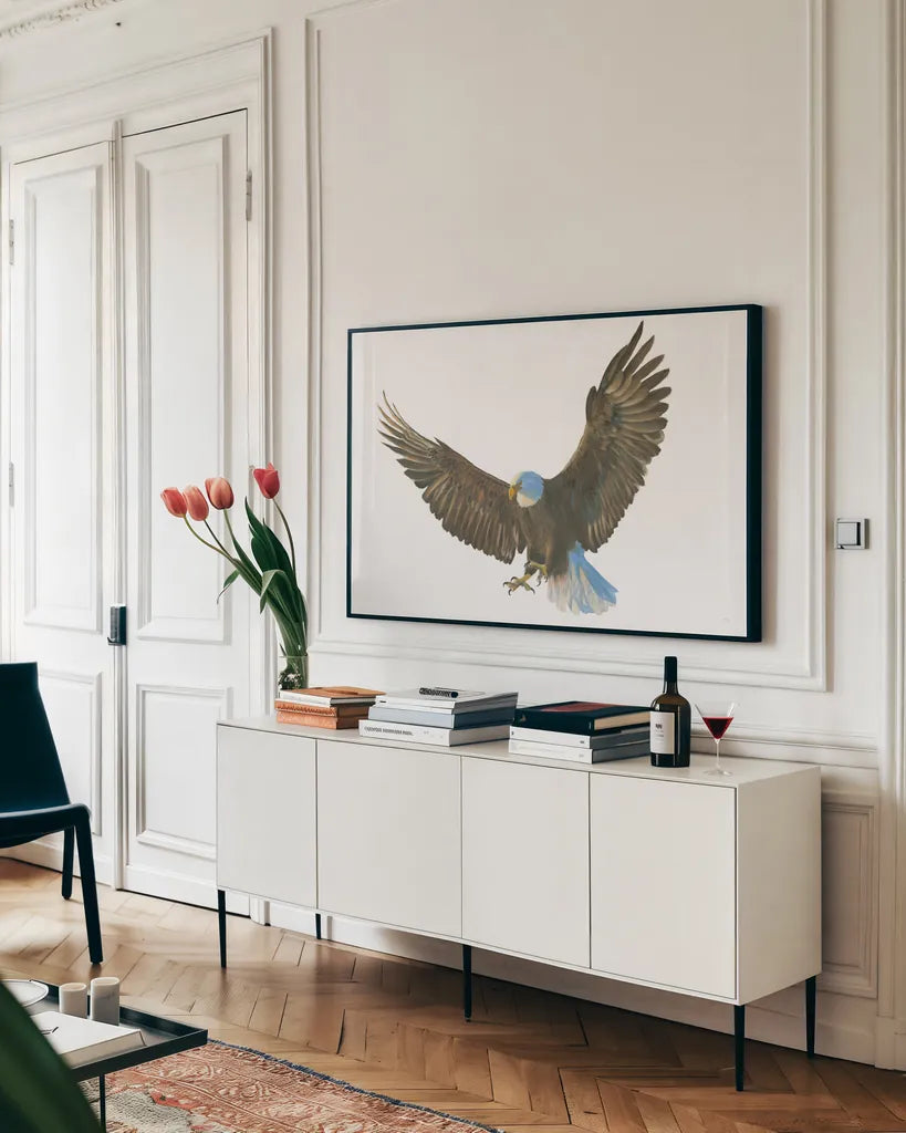 Eagle Landing by Wellington Studio. shown as a framed stretched canvas in a living room above a console. Available as a archival giclee rolled canvas, fine art paper, or poster print. SKU 62402i.