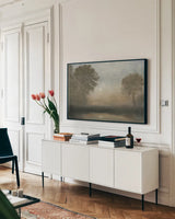 Moon at Dusk by Wellington Studio. shown as a framed stretched canvas in a living room above a console. Available as a archival giclee rolled canvas, fine art paper, or poster print. SKU 89444i.