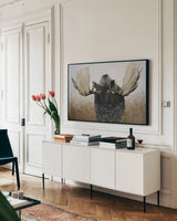 Moose by Wellington Studio. shown as a framed stretched canvas in a living room above a console. Available as a archival giclee rolled canvas, fine art paper, or poster print. SKU 84085i.