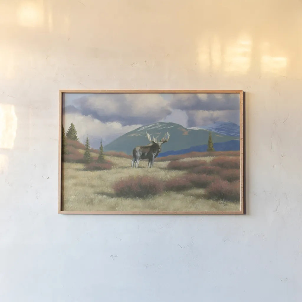 Northern Moose by Wellington Studio. shown as a paper print in a natural frame. Available as a archival giclee rolled canvas, fine art paper, or poster print. SKU 84086i.
