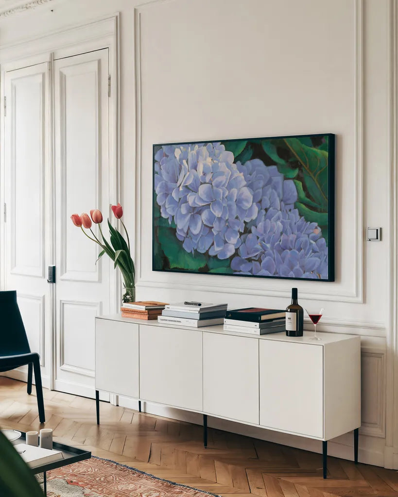 Periwinkle Hydrangea by Wellington Studio. shown as a framed stretched canvas in a living room above a console. Available as a archival giclee rolled canvas, fine art paper, or poster print. SKU 97130i.