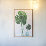 Statement Palms II by Wellington Studio. shown as a paper print in a natural frame. Available as a archival giclee rolled canvas, fine art paper, or poster print. SKU 33611h.