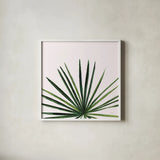 Statement Palms III by Wellington Studio. Shown in a crisp white glass frame for a clean and minimalist style. Available as an archival giclee rolled canvas, fine art paper, or poster print. SKU 33612a.