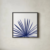 Statement Palms III Indigo by Wellington Studio. Shown in a sleek black glass frame for a contemporary gallery look. Available as an archival giclee rolled canvas, fine art paper, or poster print. SKU 34075a.