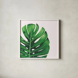 Statement Palms IV by Wellington Studio. Shown in a crisp white glass frame for a clean and minimalist style. Available as an archival giclee rolled canvas, fine art paper, or poster print. SKU 33613a.