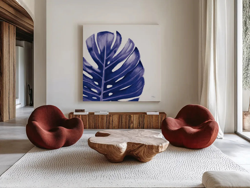 Statement Palms IV Indigo by Wellington Studio. Shown as extra-large giant wall art in a modern living room. Available as an archival giclee rolled canvas, fine art paper, or poster print. SKU 34076a.