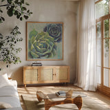 Succulents I by Wellington Studio. Shown in a natural wood frame in a cozy modern living room. Available as an archival giclee rolled canvas, fine art paper, or poster print. SKU 18137a.