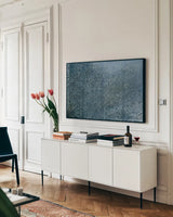 Textures IV by Wellington Studio. shown as a framed stretched canvas in a living room above a console. Available as a archival giclee rolled canvas, fine art paper, or poster print. SKU 86883i.