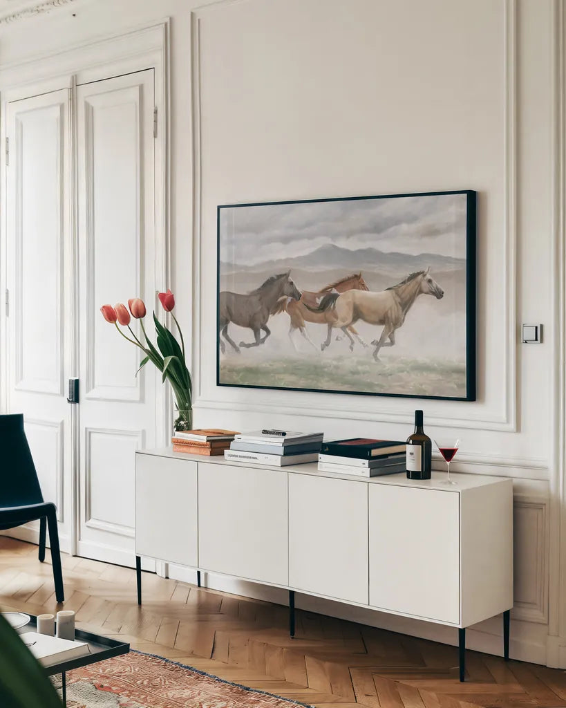 Wild Horses by Wellington Studio. shown as a framed stretched canvas in a living room above a console. Available as a archival giclee rolled canvas, fine art paper, or poster print. SKU 84113i.