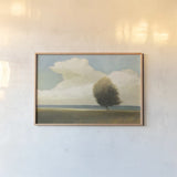 Windblown Tree by Wellington Studio. shown as a paper print in a natural frame. Available as a archival giclee rolled canvas, fine art paper, or poster print. SKU 89450i.