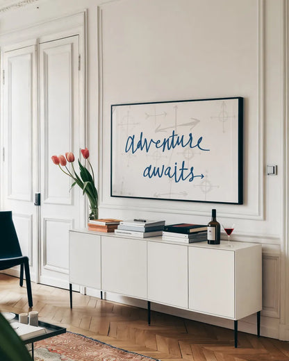 Adventure Awaits v2 by Wild Apple Portfolio. shown as a framed stretched canvas in a living room above a console. Available as a archival giclee rolled canvas, fine art paper, or poster print. SKU 37423i.