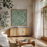 Amadora Dark Green Tile IV by Wild Apple Portfolio. Shown in a natural wood frame in a cozy modern living room. Available as an archival giclee rolled canvas, fine art paper, or poster print. SKU 56952a.
