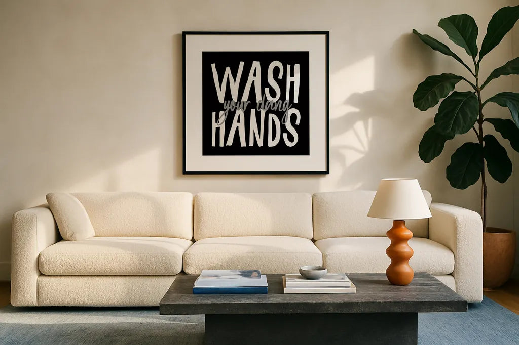 Bathroom Advice I BW by Wild Apple Portfolio. Displayed in a glass frame with matte in a clean modern living room. Available as an archival giclee rolled canvas, fine art paper, or poster print. SKU 84765a.