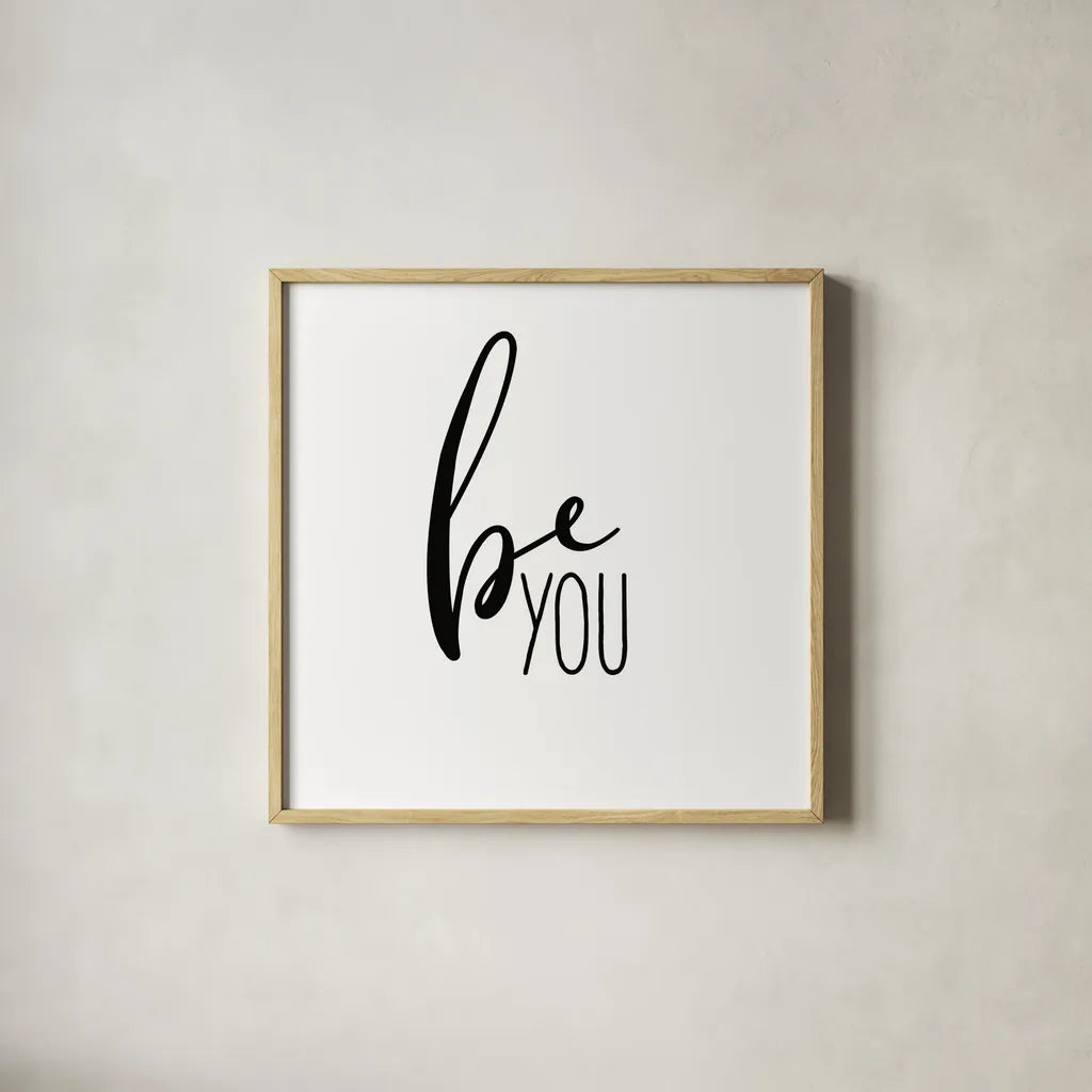 Be You by Wild Apple Portfolio. Shown in a natural wood glass frame for a timeless modern aesthetic. Available as an archival giclee rolled canvas, fine art paper, or poster print. SKU 59254a.