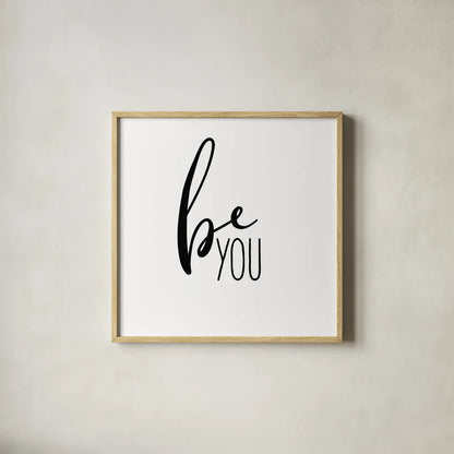 Be You by Wild Apple Portfolio. Shown in a natural wood glass frame for a timeless modern aesthetic. Available as an archival giclee rolled canvas, fine art paper, or poster print. SKU 59254a.