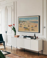 Beach Postcard I Plain Border by Wild Apple Portfolio. shown as a framed stretched canvas in a living room above a console. Available as a archival giclee rolled canvas, fine art paper, or poster print. SKU 57822i.