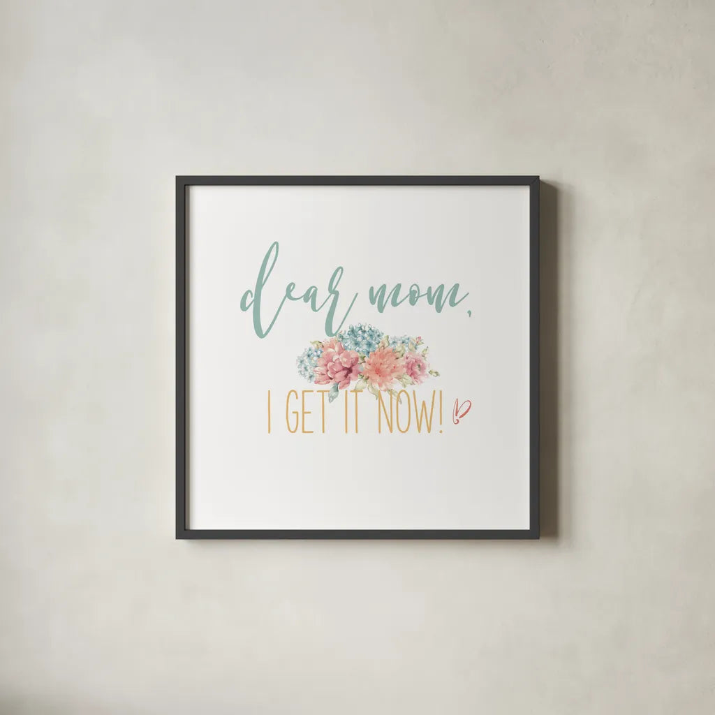 Bloom Mom Inspiration I by Wild Apple Portfolio. Shown in a sleek black glass frame for a contemporary gallery look. Available as an archival giclee rolled canvas, fine art paper, or poster print. SKU 57245a.