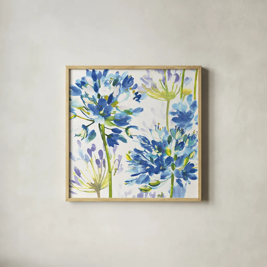 Blue Medley III by Wild Apple Portfolio. Shown in a natural wood glass frame for a timeless modern aesthetic. Available as an archival giclee rolled canvas, fine art paper, or poster print. SKU 13258a.