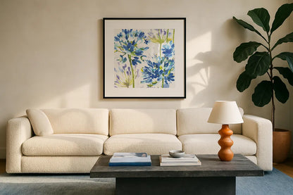 Blue Medley III by Wild Apple Portfolio. Displayed in a glass frame with matte in a clean modern living room. Available as an archival giclee rolled canvas, fine art paper, or poster print. SKU 13258a.