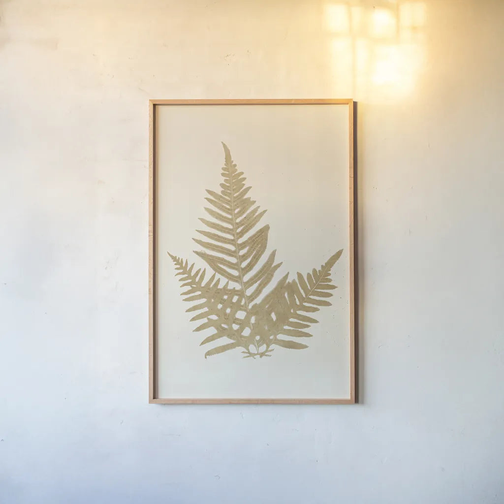 Botanical Fern XI Gold by Wild Apple Portfolio. shown as a paper print in a natural frame. Available as a archival giclee rolled canvas, fine art paper, or poster print. SKU 57688h.