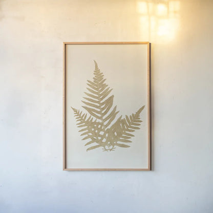 Botanical Fern XI Gold by Wild Apple Portfolio. shown as a paper print in a natural frame. Available as a archival giclee rolled canvas, fine art paper, or poster print. SKU 57688h.