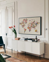 Botanical Floral Map Light by Wild Apple Portfolio. shown as a framed stretched canvas in a living room above a console. Available as a archival giclee rolled canvas, fine art paper, or poster print. SKU 53455i.