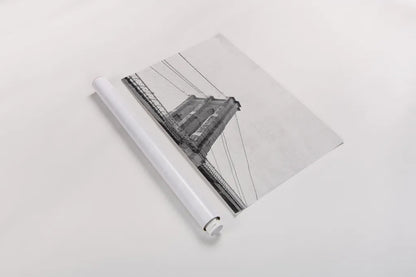 Brooklyn Bridge From Below by Wild Apple Portfolio. shown as a rolled paper print. Available as archival giclee rolled canvas, fine art paper, or poster print. SKU 67630i.