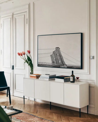 Brooklyn Bridge From Below by Wild Apple Portfolio. shown as a framed stretched canvas in a living room above a console. Available as a archival giclee rolled canvas, fine art paper, or poster print. SKU 67630i.
