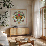 Butterfly Mandala I by Wild Apple Portfolio. Shown in a natural wood frame in a cozy modern living room. Available as an archival giclee rolled canvas, fine art paper, or poster print. SKU 34402a.