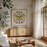 Butterfly Mandala III by Wild Apple Portfolio. Shown in a natural wood frame in a cozy modern living room. Available as an archival giclee rolled canvas, fine art paper, or poster print. SKU 34404a.