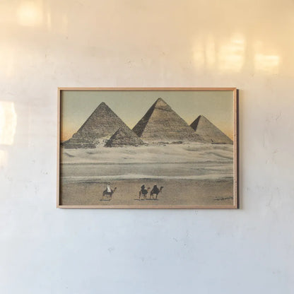 Cairo Pyramids by Wild Apple Portfolio. shown as a paper print in a natural frame. Available as a archival giclee rolled canvas, fine art paper, or poster print. SKU 71206i.