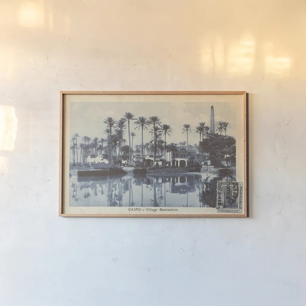 Cairo Village by Wild Apple Portfolio. shown as a paper print in a natural frame. Available as a archival giclee rolled canvas, fine art paper, or poster print. SKU 71225i.