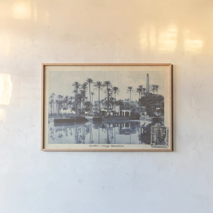 Cairo Village by Wild Apple Portfolio. shown as a paper print in a natural frame. Available as a archival giclee rolled canvas, fine art paper, or poster print. SKU 71225i.