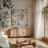 Ceylon Gardens IV Black and Gold by Wild Apple Portfolio. Shown in a natural wood frame in a cozy modern living room. Available as an archival giclee rolled canvas, fine art paper, or poster print. SKU 28729a.