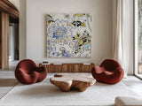Ceylon Gardens VI Black and Gold by Wild Apple Portfolio. Shown as extra-large giant wall art in a modern living room. Available as an archival giclee rolled canvas, fine art paper, or poster print. SKU 28731a.