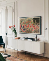 Chicago Postcard I v2 by Wild Apple Portfolio. shown as a framed stretched canvas in a living room above a console. Available as a archival giclee rolled canvas, fine art paper, or poster print. SKU 83557i.