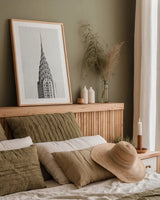 Chrysler Building NYC by Wild Apple Portfolio. shown as a paper print in a natural frame. Available as a archival giclee rolled canvas, fine art paper, or poster print. SKU 67631h.