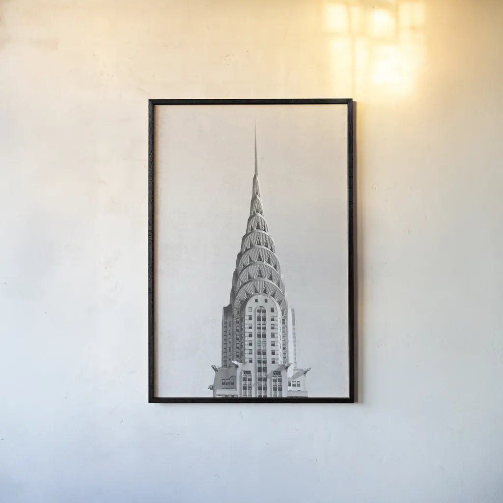 Chrysler Building NYC by Wild Apple Portfolio. shown as a paper print in a black flame. Available as a archival giclee rolled canvas, fine art paper, or poster print. SKU 67631h.