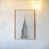 Chrysler Building NYC by Wild Apple Portfolio. shown as a paper print in a natural frame. Available as a archival giclee rolled canvas, fine art paper, or poster print. SKU 67631h.