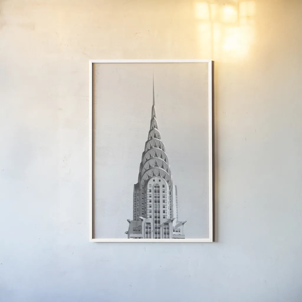 Chrysler Building NYC by Wild Apple Portfolio. shown as a paper print in a white frame. Available as a archival giclee rolled canvas, fine art paper, or poster print. SKU 67631h.
