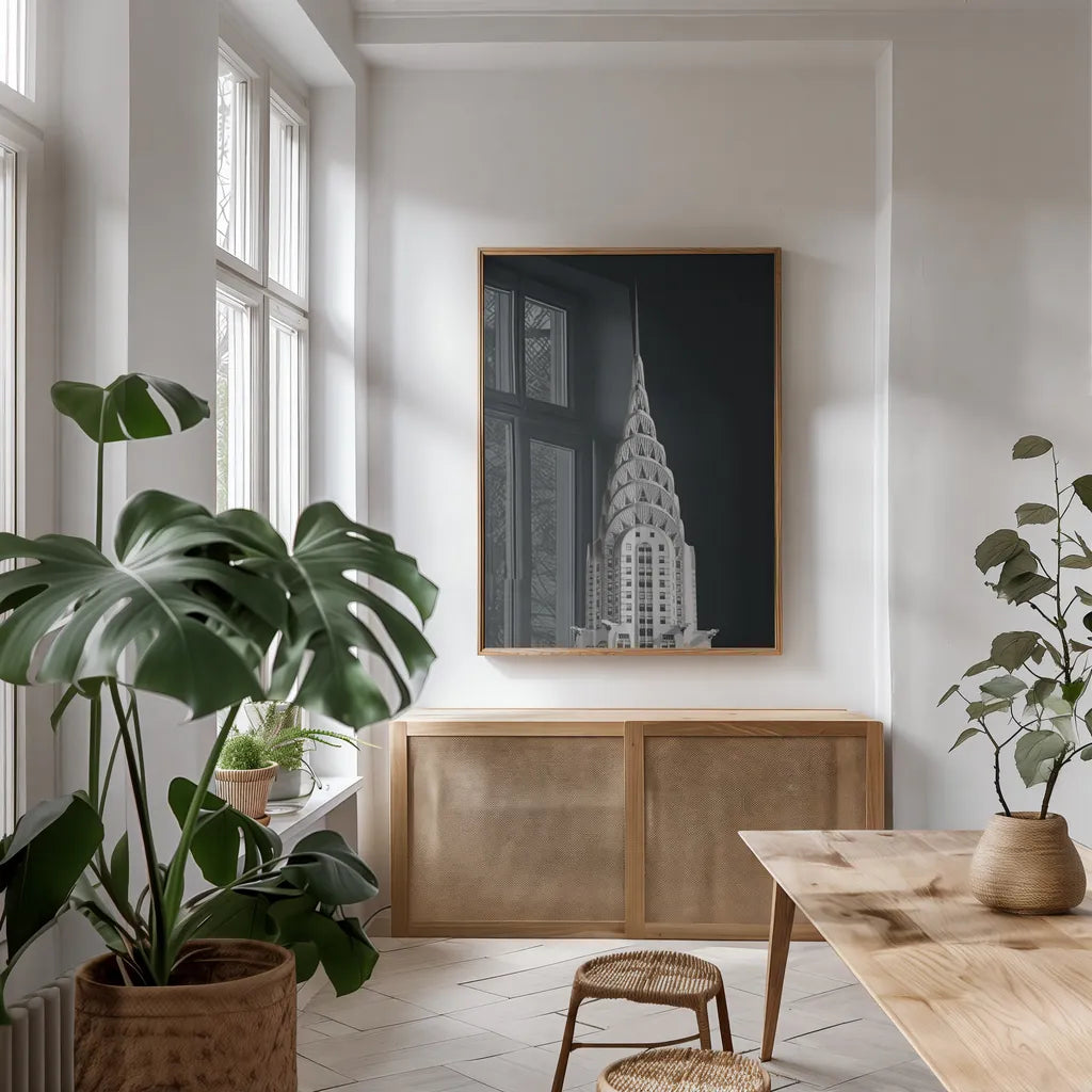 Chrysler Building on Black by Wild Apple Portfolio. shown as a print in a natural wood frame in a dining room. Available as a archival giclee rolled canvas, fine art paper, or poster print. SKU 68472h.