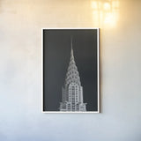Chrysler Building on Black by Wild Apple Portfolio. shown as a paper print in a white frame. Available as a archival giclee rolled canvas, fine art paper, or poster print. SKU 68472h.