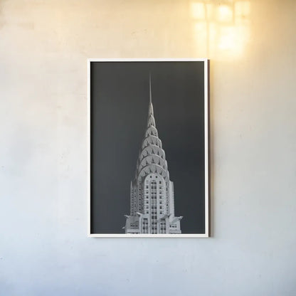 Chrysler Building on Black by Wild Apple Portfolio. shown as a paper print in a white frame. Available as a archival giclee rolled canvas, fine art paper, or poster print. SKU 68472h.