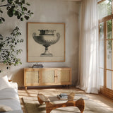 Classical Urns VI by Wild Apple Portfolio. Shown in a natural wood frame in a cozy modern living room. Available as an archival giclee rolled canvas, fine art paper, or poster print. SKU 104691a.