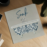 Cottage Bath II Gray by Wild Apple Portfolio. Shown as a detailed flat fine art print, highlighting archival giclee quality. Available as an archival giclee rolled canvas, fine art paper, or poster print. SKU 63057a.