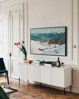 Downhill Skiing by Wild Apple Portfolio. shown as a framed stretched canvas in a living room above a console. Available as a archival giclee rolled canvas, fine art paper, or poster print. SKU 104287i.