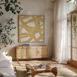 Endless Circles Front Gold III by Wild Apple Portfolio. Shown in a natural wood frame in a cozy modern living room. Available as an archival giclee rolled canvas, fine art paper, or poster print. SKU 32245a.