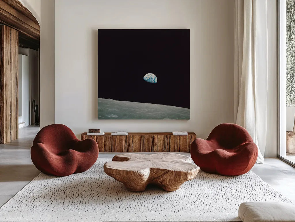 First Earth Rise by Wild Apple Portfolio. Shown as extra-large giant wall art in a modern living room. Available as an archival giclee rolled canvas, fine art paper, or poster print. SKU 84536a.
