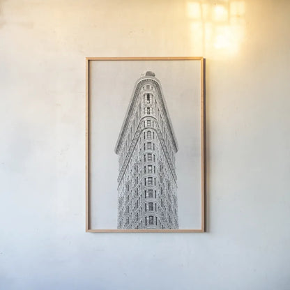Flatiron Building NYC by Wild Apple Portfolio. shown as a paper print in a natural frame. Available as a archival giclee rolled canvas, fine art paper, or poster print. SKU 67632h.